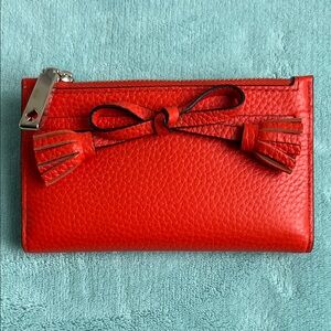 Kate Spade Vibrant Orange Wallet with Tassel Accents